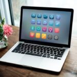 laptop-wooden-table_53876-20635